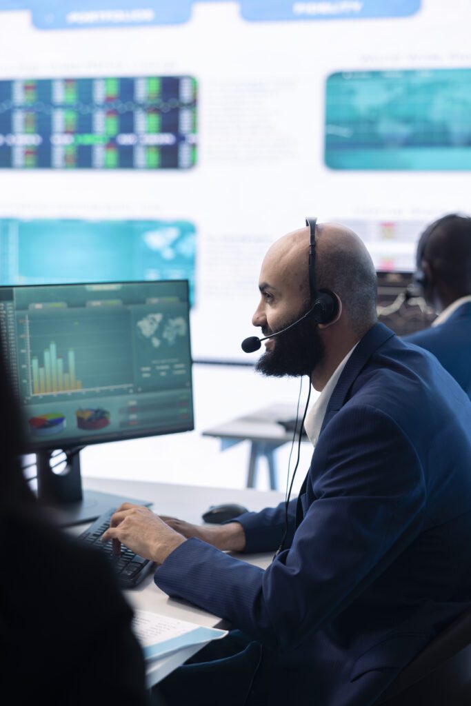 Professional man working at his desk, reviewing fintech data and digital financial reports.