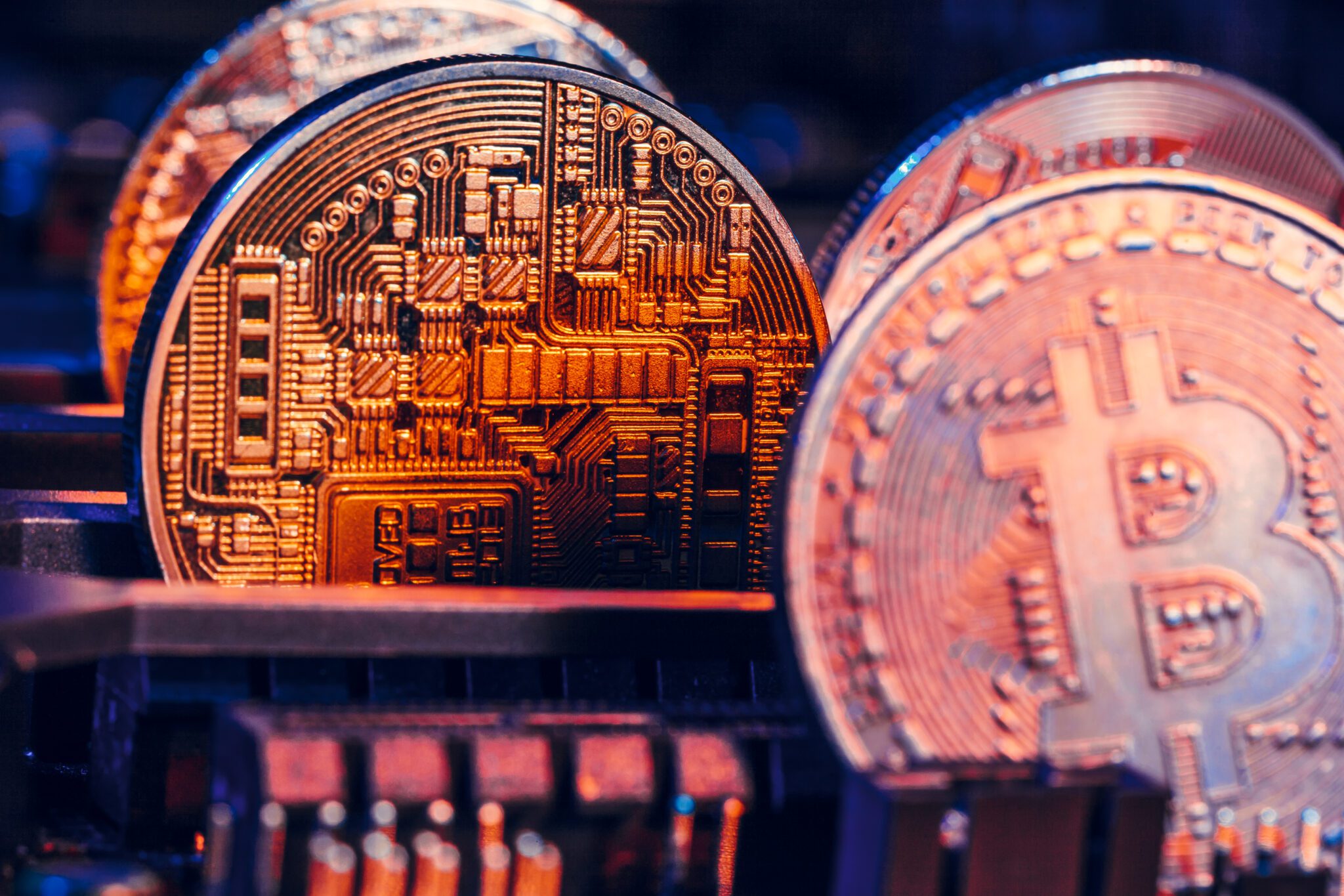 Close-up of a motherboard with a Bitcoin coin, symbolizing the intersection of cryptocurrency and fintech technology