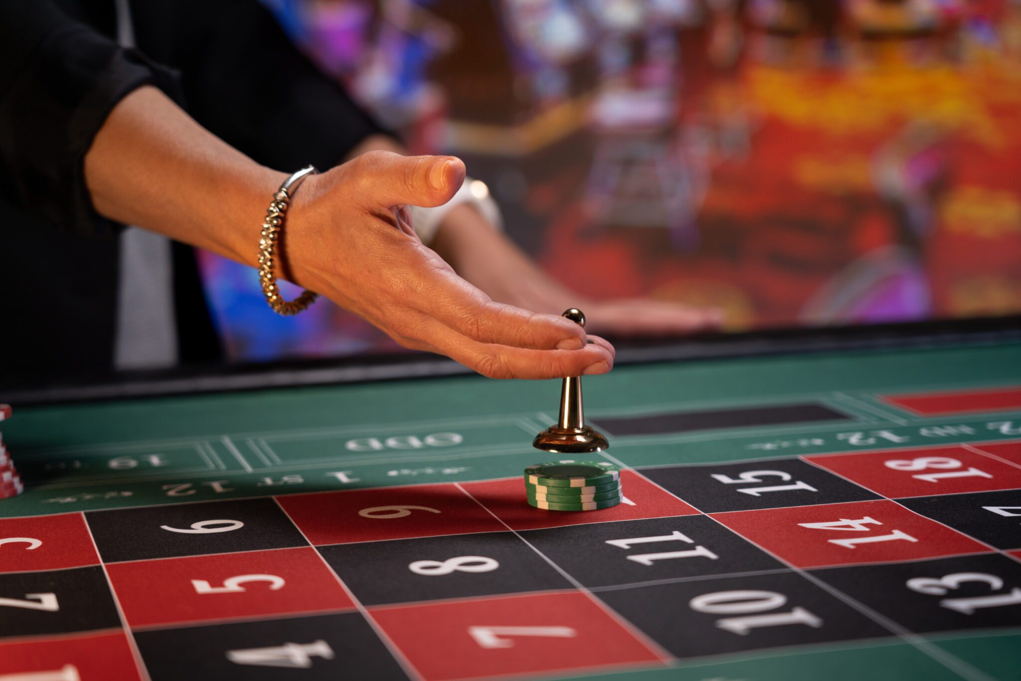 An overview of iGaming services with a focus on a roulette table, highlighting areas like regulatory compliance, market analysis, investment advisory, risk management, technology solutions, operational support, and marketing strategy for online gaming and betting businesses.