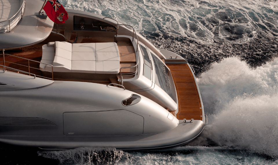 Luxury yacht anchored in calm blue waters, representing premium yachting services.
